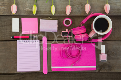 Overhead of female accessories, stationery and coffee
