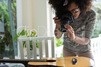 Graphic designer taking picture with digital camera