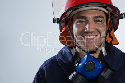 Fireman looking at camera against white background