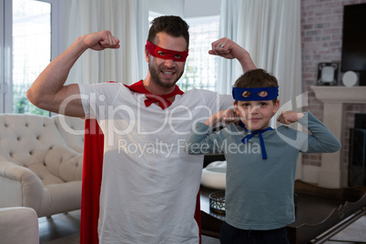 Father and son pretending to be superhero