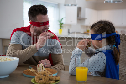Father and daughter pretending to be superhero