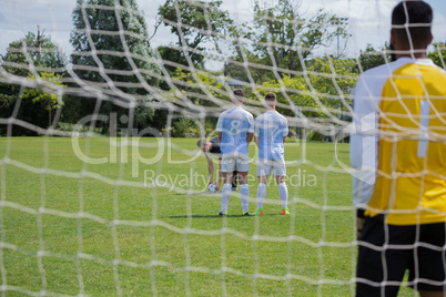 Soccer player is ready to kick ball from penalty spot