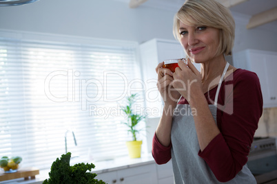 Portrait of happy woman having lemon tea