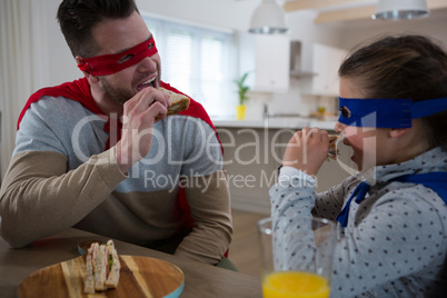 Father and daughter pretending to be superhero