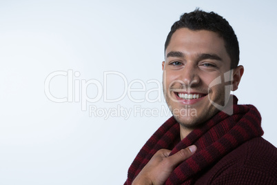 Man in warm clothing smiling at camera