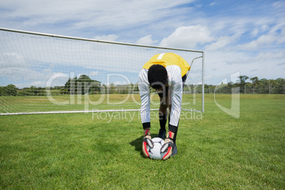 Goalkeeper ready to kick the soccer ball