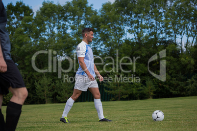 Football player ready to kick the soccer ball