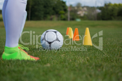 Soccer player practicing in the ground