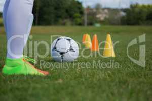 Soccer player practicing in the ground