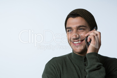 Man in winter cloth talking on mobile phone