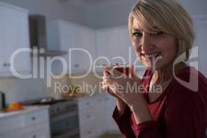 Portrait of happy woman having lemon tea