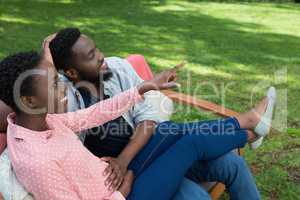 Happy couple interacting with each other in park