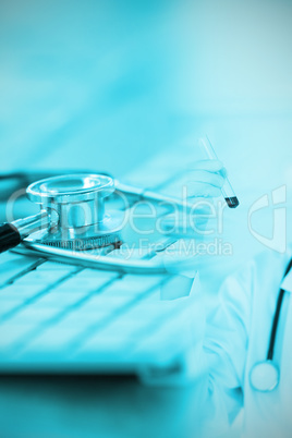 Composite image of close-up of keyboard with stethoscope
