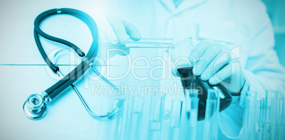 Composite image of stethoscope on desk