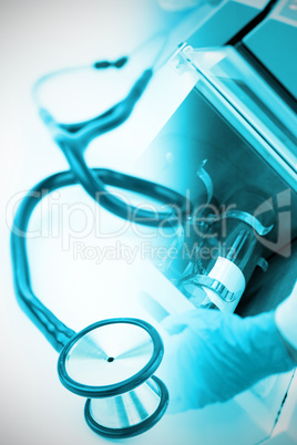 Composite image of blue stethoscope