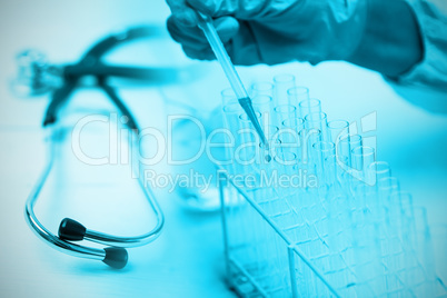 Composite image of stethoscope on desk