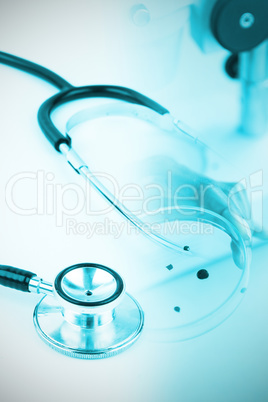 Composite image of metal black stethoscope