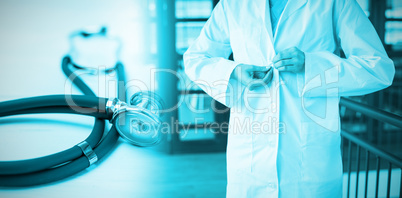 Composite image of stethoscope on desk