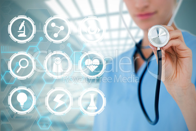 Composite image of doctor listening with stethoscope