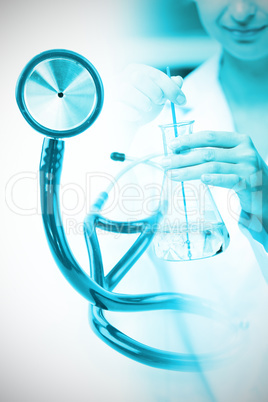 Composite image of blue stethoscope