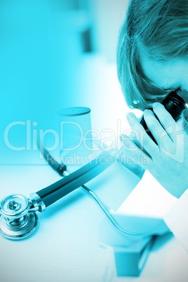 Composite image of stethoscope on desk