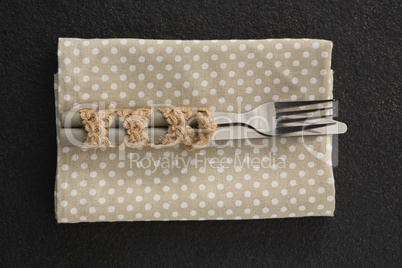 Fork and knife on a dotted napkin