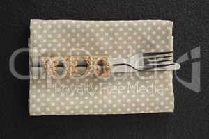 Fork and knife on a dotted napkin