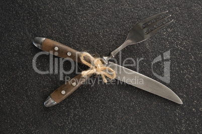 Knife and fork tied with a string