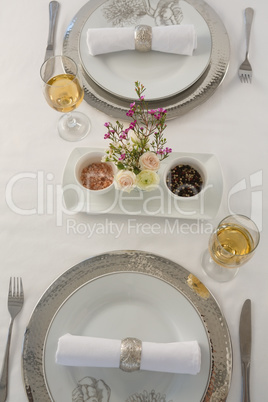 Plate and cutlery set elegantly on a table