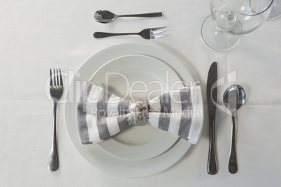 Plate and cutlery set elegantly on a table