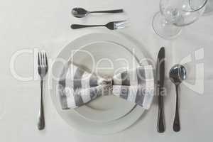 Plate and cutlery set elegantly on a table