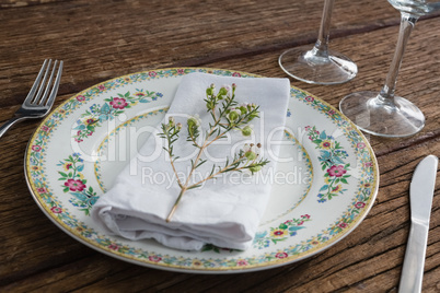 Flower with napkin on a plate