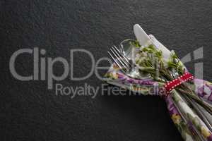 Cutlery with flower and napkin tied with ribbon