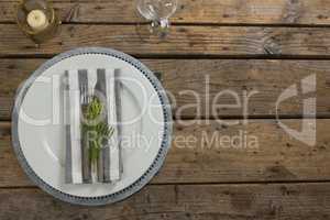 Elegance table setting on wooden plank