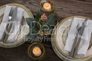 Elegance table setting on wooden plank