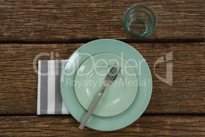 Plate with fork, napkin and glass