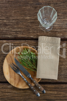 Flora and cutlery arranged on plate