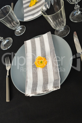 Beautiful table setting with floral arrangement