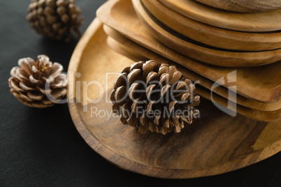 Wooden plates set on a black theme table