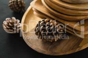 Wooden plates set on a black theme table