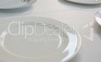 Empty plates on white background
