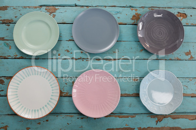 Empty plates on wooden table