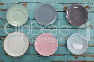 Empty plates on wooden table