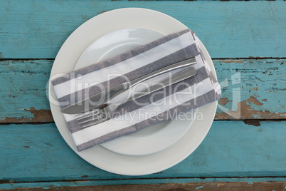 Table setting on weathered wooden plank