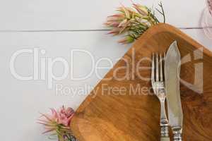 Elegance table setting on wooden plank