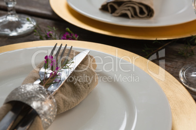 Elegance table setting on wooden plank