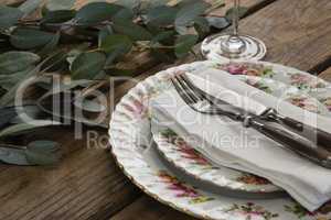 Floral pattern plate with cutlery set and leaf
