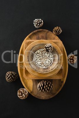 Wooden plates set on a black themed table
