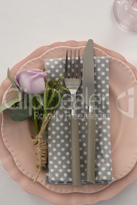Beautiful table setting with floral arrangement