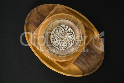 Wooden plates set on a black theme table